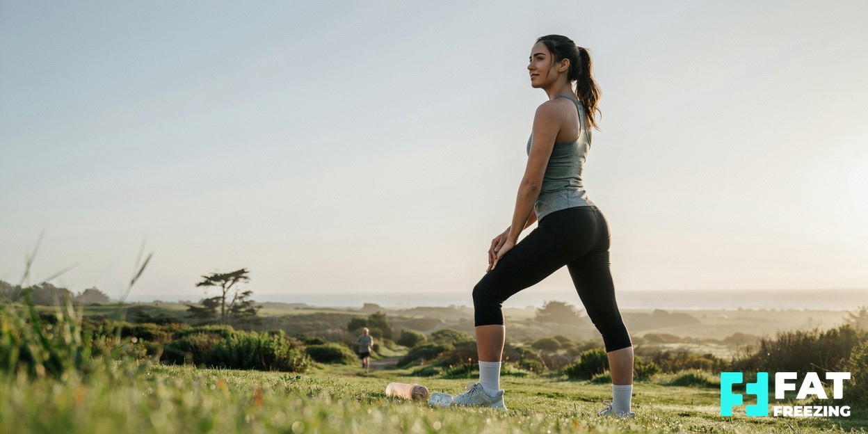 A person in activewear stretching outdoors in soft morning light, conveying a healthy active lifestyle