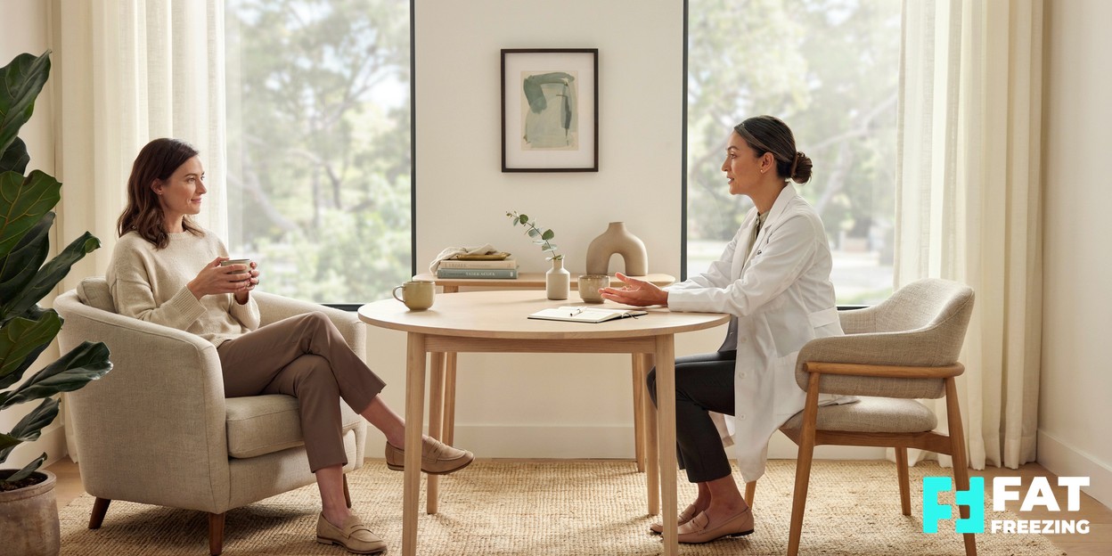 A calm, modern aesthetics clinic consultation room with soft natural light and a relaxed person sitting comfortably while talking with a practitioner