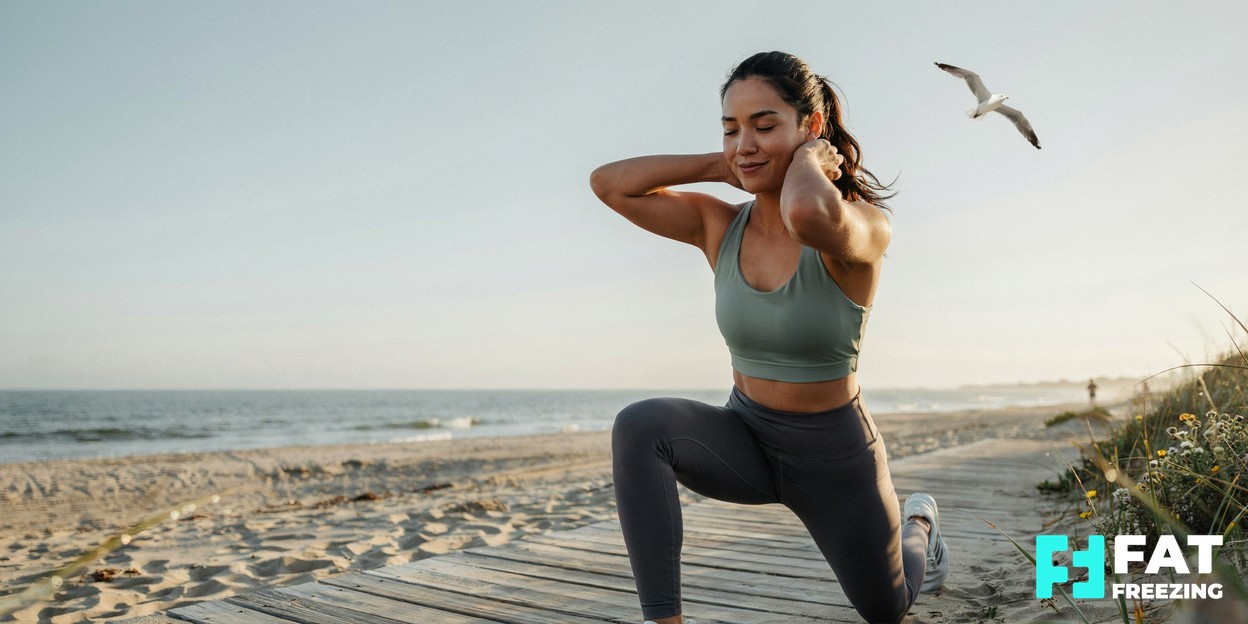 A person in activewear stretching outdoors in soft morning light, looking healthy and confident