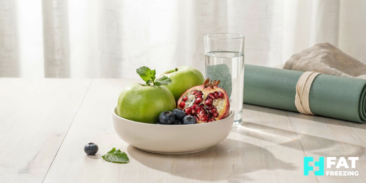 A serene wellness setting with fresh fruit, water and a yoga mat in calm natural light, suggesting a balanced healthy lifestyle